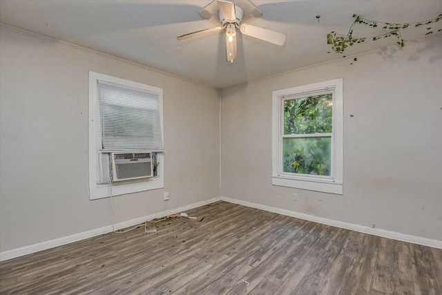 unfurnished room featuring hardwood / wood-style floors, ceiling fan, cooling unit, and crown molding