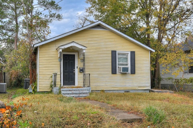 bungalow with central air condition unit and cooling unit