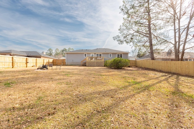 view of yard with a wooden deck