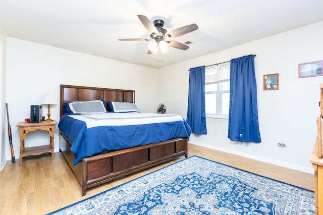 bedroom featuring ceiling fan and light hardwood / wood-style floors