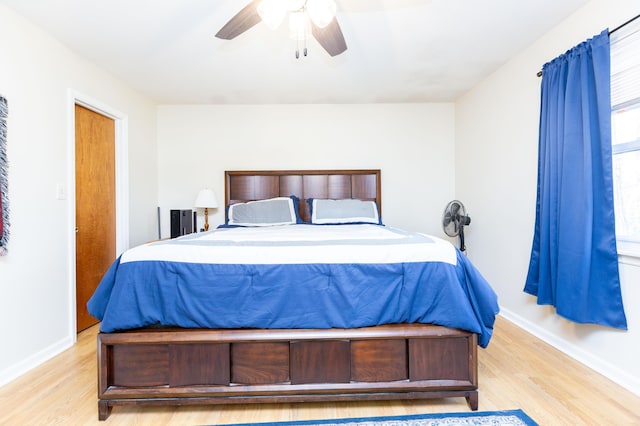 bedroom featuring ceiling fan and light hardwood / wood-style flooring