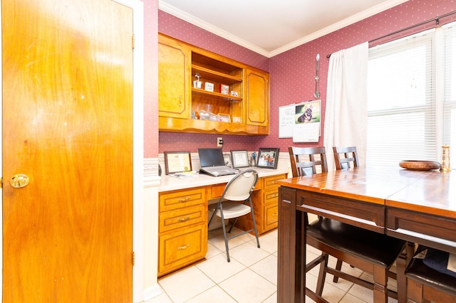 tiled home office featuring crown molding and built in desk