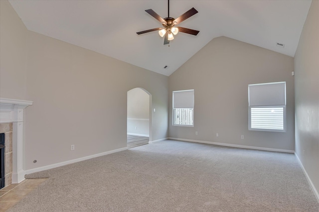 610 Creek Bottom Trl, Grovetown, GA 30813 - unfurnished living room featuring light colored carpet, high vaulted ceiling, a ceiling fan, a wealth of natural light, and a tile fireplace