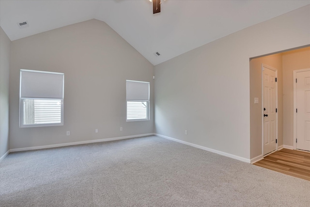 610 Creek Bottom Trl, Grovetown, GA 30813 - spare room with carpet flooring, high vaulted ceiling, visible vents, and baseboards