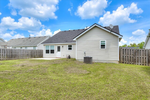 610 Creek Bottom Trl, Grovetown, GA 30813 - back of house with a fenced backyard, a patio, central AC, and roof with shingles