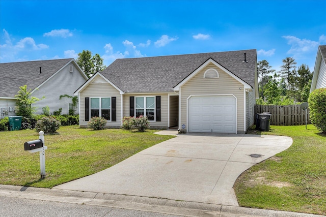 ranch-style home featuring concrete driveway, an attached garage, fence, and a front yard