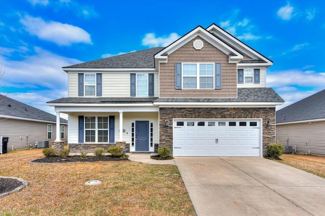 view of front of house with stone siding, a garage, concrete driveway, and central AC