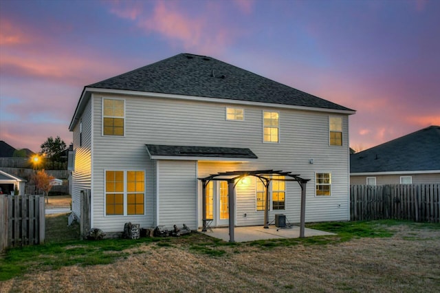 7050 Summerton Dr, Augusta, GA 30909 - back of house at dusk with a yard, a patio, a fenced backyard, and a pergola