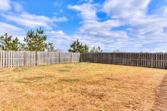 view of yard with a fenced backyard