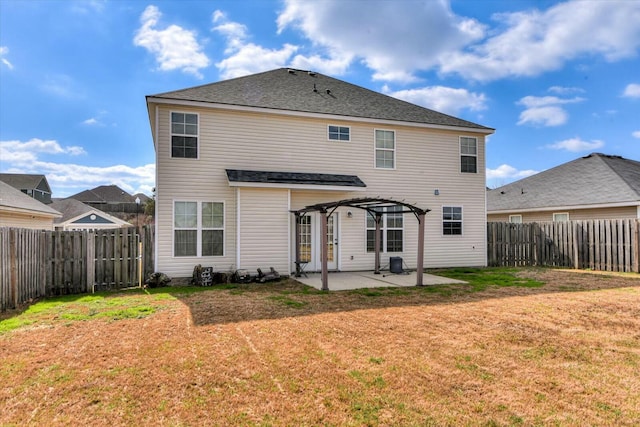 back of property featuring a patio area, a fenced backyard, a yard, and a pergola