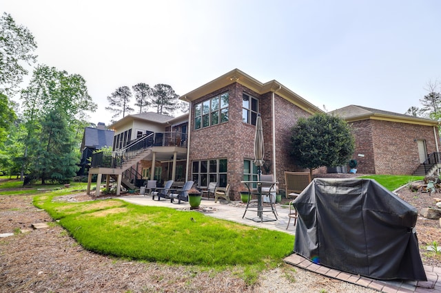 148 Grandview Dr, Mccormick, SC 29835 - back of property featuring a patio area, a wooden deck, brick siding, and stairs
