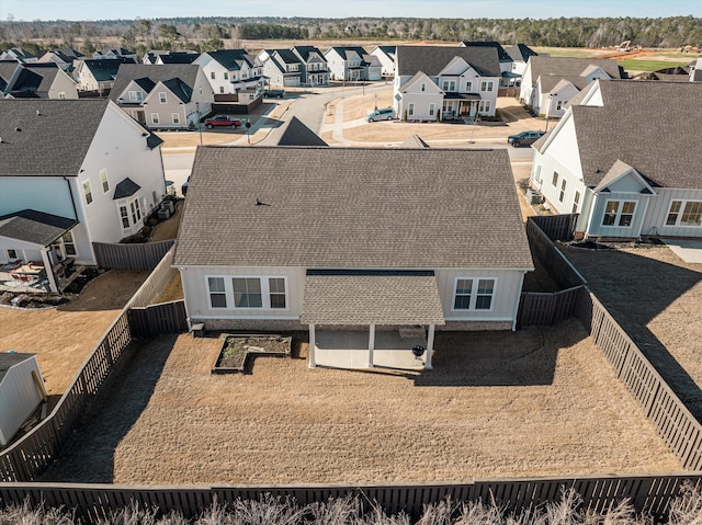 birds eye view of property with a residential view