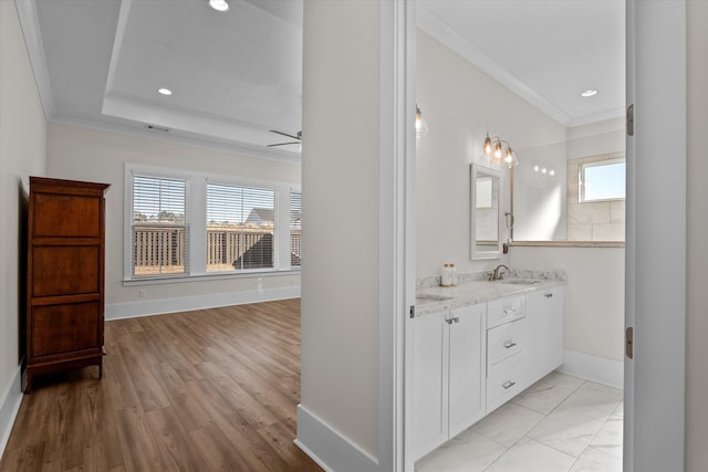 full bathroom with recessed lighting, crown molding, baseboards, and a sink