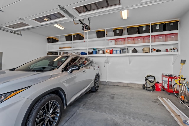 garage featuring electric panel and a garage door opener