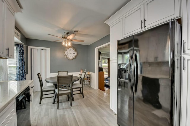 dining space featuring ceiling fan, light wood-type flooring, and a wealth of natural light