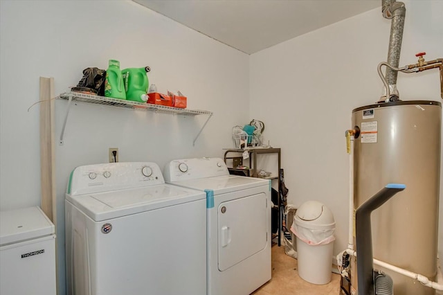 washroom with washer and clothes dryer and gas water heater