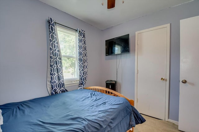 carpeted bedroom with ceiling fan