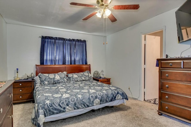 bedroom with light carpet and ceiling fan