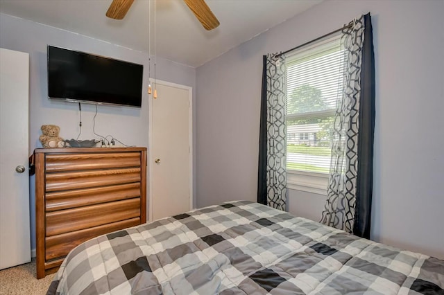 carpeted bedroom featuring ceiling fan