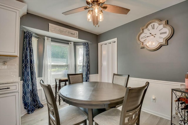 dining area featuring light hardwood / wood-style floors and ceiling fan