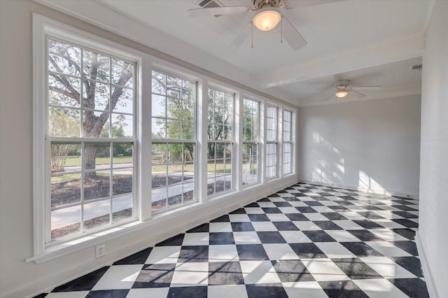 unfurnished sunroom with beam ceiling