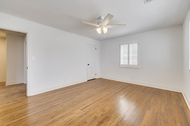 unfurnished room with light hardwood / wood-style flooring and ceiling fan