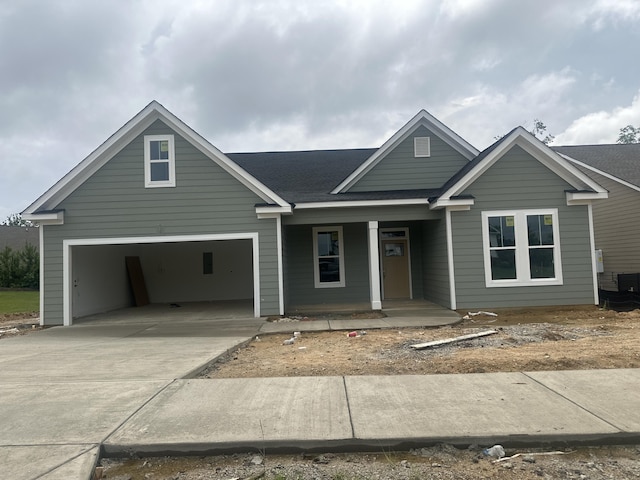 318 Holly Oak Way Unit Sc68, Grovetown, GA 30813 - view of front of house with a porch, a garage, driveway, and roof with shingles