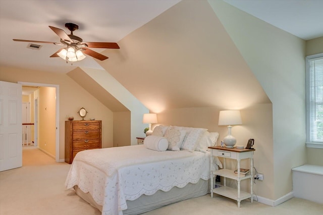 carpeted bedroom with lofted ceiling, visible vents, a ceiling fan, and baseboards