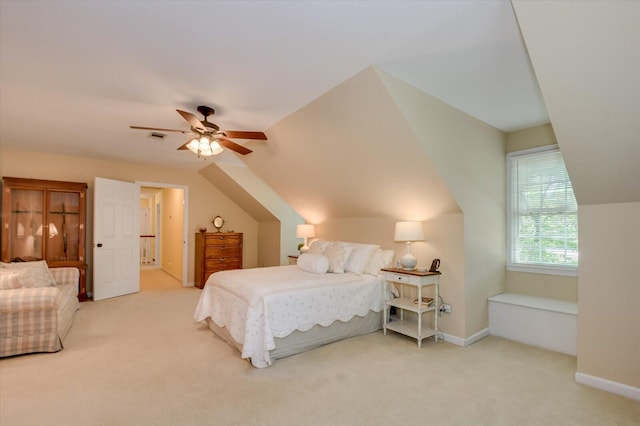 bedroom featuring vaulted ceiling, visible vents, carpet flooring, and a ceiling fan