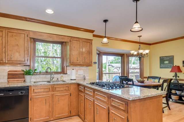 kitchen with stainless steel gas stovetop, dishwasher, a sink, light wood-type flooring, and a peninsula