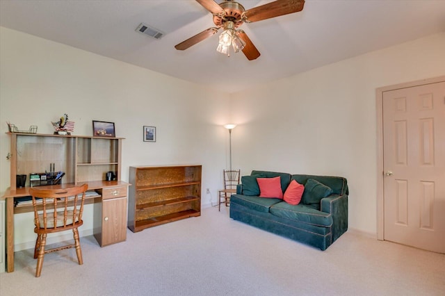 interior space featuring visible vents, carpet flooring, and ceiling fan