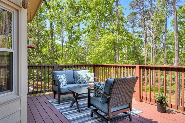 wooden deck with an outdoor hangout area