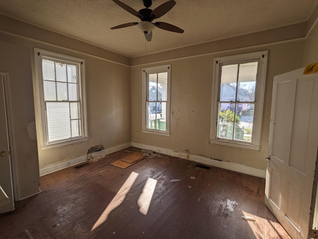 1316 Druid Park Ave, Augusta, GA 30904 - unfurnished room featuring wood-type flooring, ceiling fan, baseboards, a textured ceiling, and crown molding