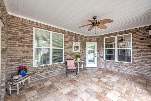 view of patio / terrace featuring ceiling fan
