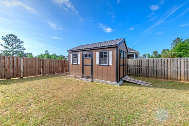 view of shed featuring a fenced backyard