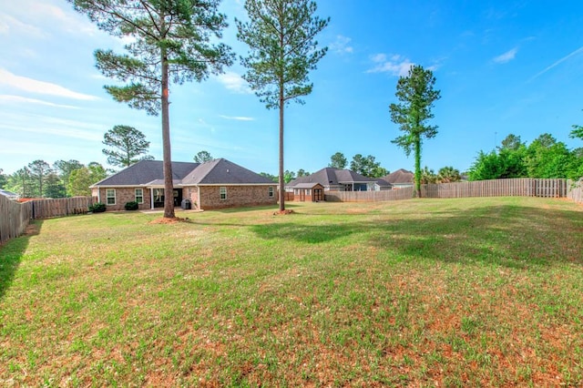 view of yard featuring a fenced backyard