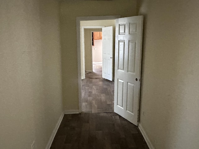 hall with dark hardwood / wood-style floors