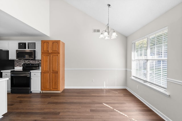 kitchen with black appliances, decorative backsplash, dark hardwood / wood-style floors, and lofted ceiling