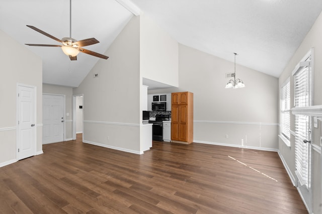 unfurnished living room featuring ceiling fan with notable chandelier, high vaulted ceiling, and dark hardwood / wood-style flooring