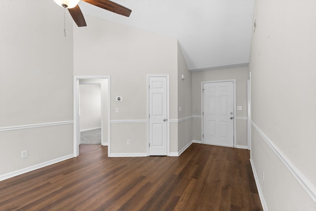 interior space featuring high vaulted ceiling, dark wood-type flooring, and ceiling fan