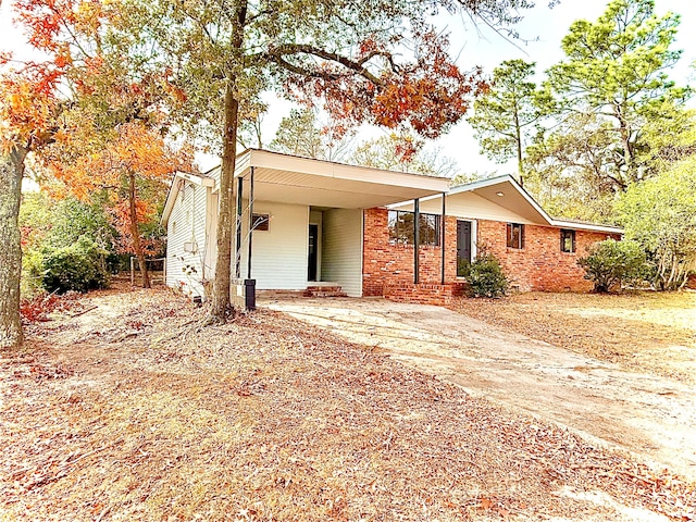 view of front of home featuring a carport