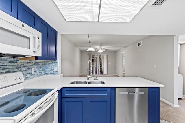 kitchen featuring ceiling fan, sink, white appliances, and blue cabinets