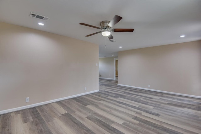 unfurnished room with ceiling fan and light hardwood / wood-style flooring