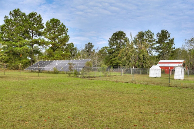 view of yard with an outbuilding and a rural view