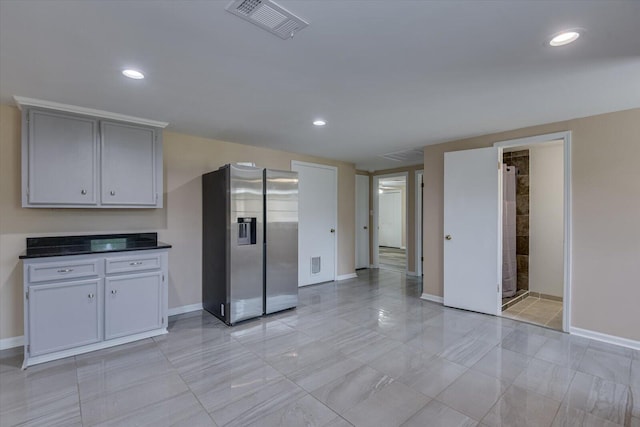 kitchen featuring stainless steel fridge