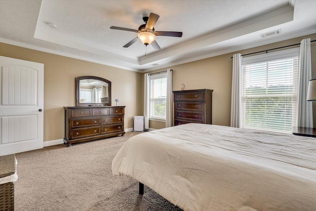 5558 Connor Dr, Evans, GA 30809 - carpeted bedroom with a tray ceiling, ornamental molding, and ceiling fan