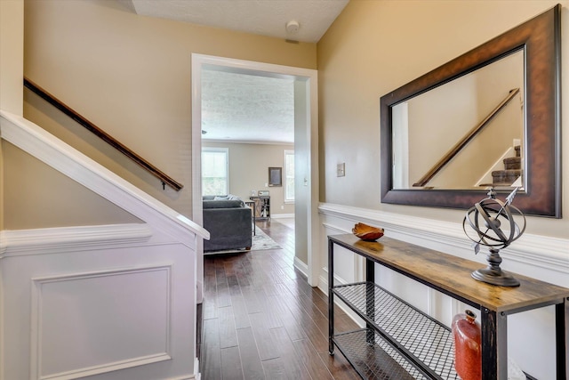 5558 Connor Dr, Evans, GA 30809 - corridor featuring stairs, dark wood-type flooring, and a textured ceiling