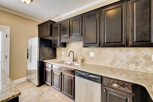 5558 Connor Dr, Evans, GA 30809 - kitchen featuring appliances with stainless steel finishes, backsplash, dark brown cabinetry, crown molding, and light stone countertops