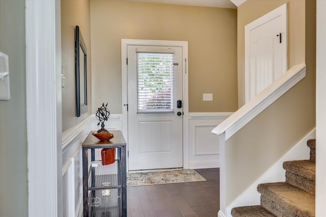 5558 Connor Dr, Evans, GA 30809 - entrance foyer featuring wainscoting, stairs, dark wood-type flooring, and a decorative wall