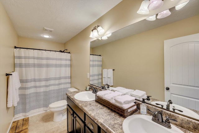 5558 Connor Dr, Evans, GA 30809 - bathroom with double vanity, a shower with shower curtain, and tile patterned floors